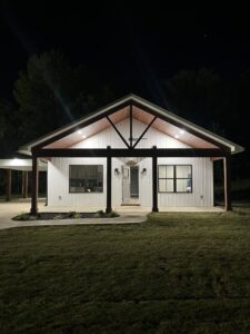 Residential exterior lighting installation showcasing a beautifully lit home by Spencer Electric in Hopkins, MN.
