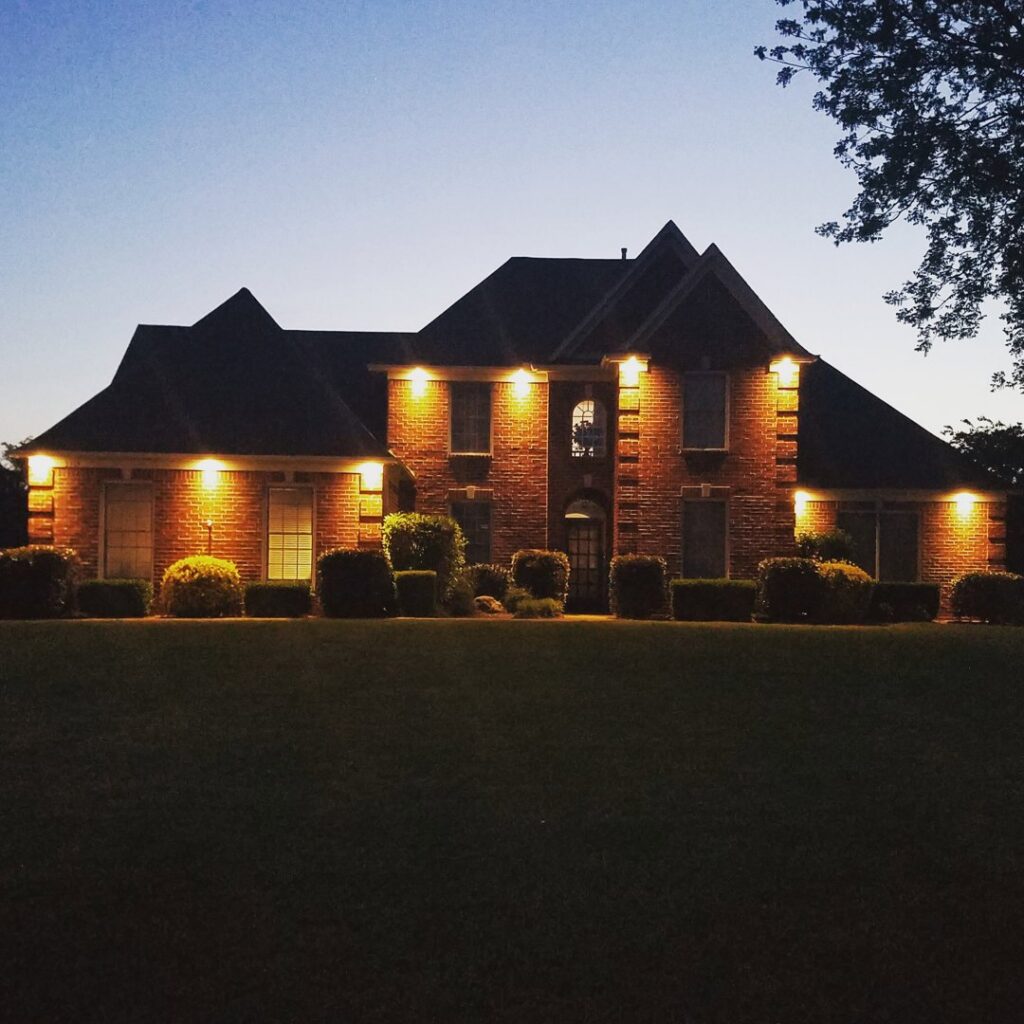 Residential exterior lighting installation on a brick home by Superior Electric and Lighting LLC in Southaven, MS