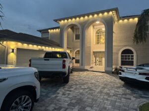 Residential exterior soffit lighting installation on a large home by Ryno Electric in Cape Coral, FL