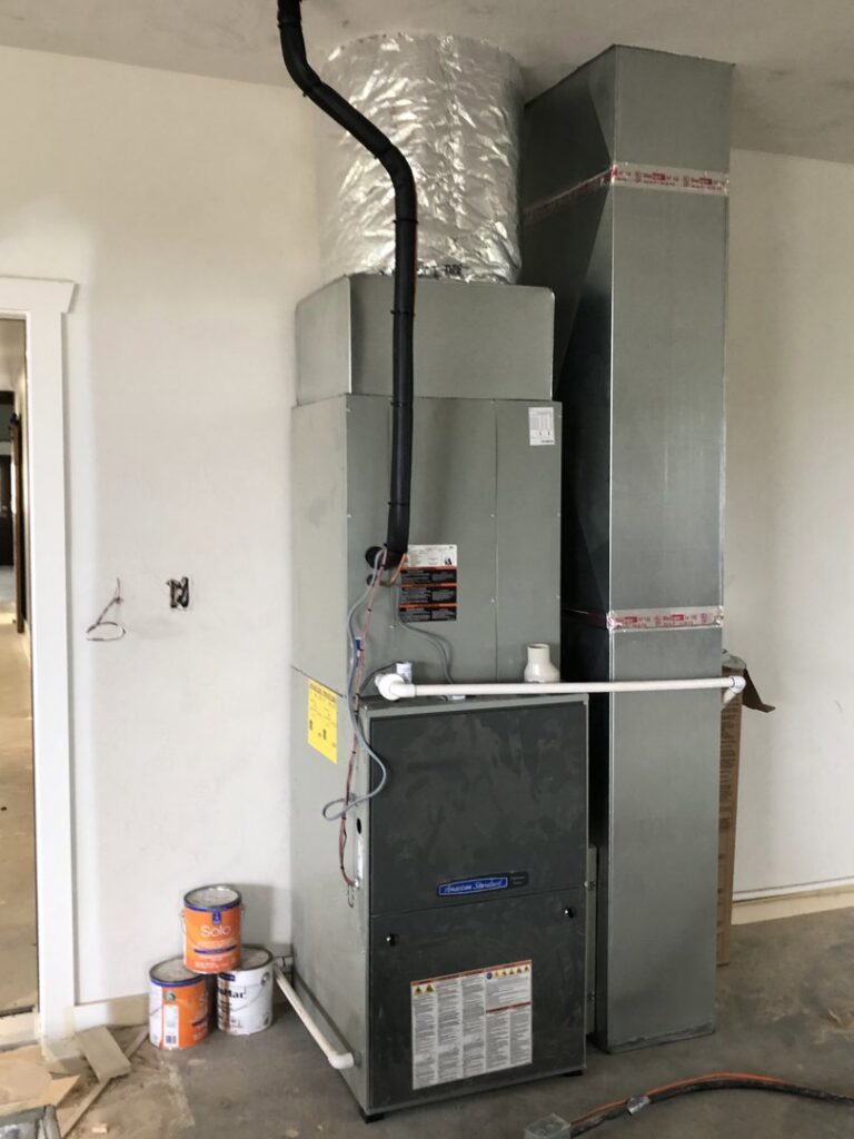 A residential furnace and ductwork installation in a utility room or garage by Crouch's Heating & Cooling LLC in Stillwater, OK.