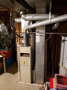 A residential furnace and ductwork installed in a basement by Frederick Plumbing, Heating & Air Conditioning in Wichita, KS