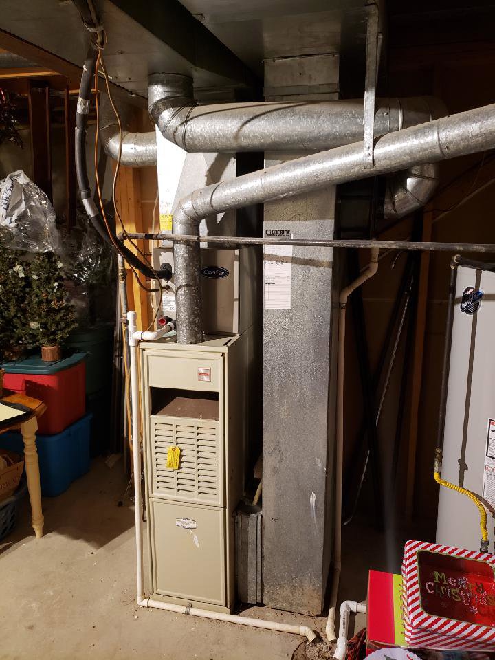 A residential furnace and ductwork installed in a basement by Frederick Plumbing, Heating & Air Conditioning in Wichita, KS