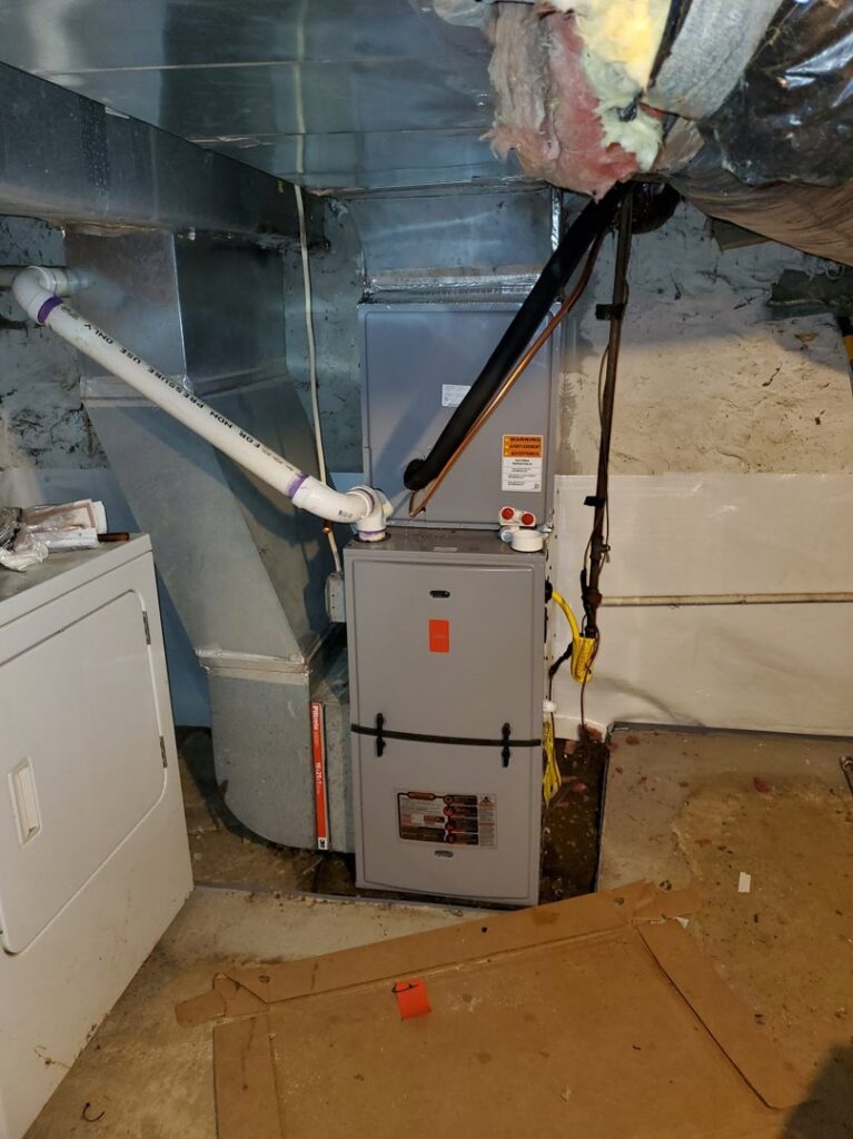 A residential furnace and ductwork installation in a basement by Absolute HVAC in Wilmington, DE.