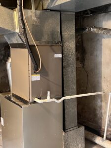 A residential furnace installation with connected ductwork in a basement, performed by HVAC Philly in Feasterville, PA.