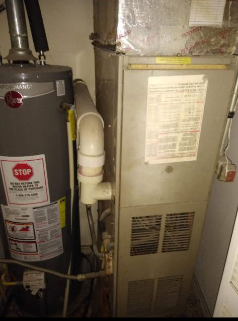 An existing residential furnace and water heater in a utility closet, serviced by RP Services llc, heating & air conditioning in Louisville, KY.