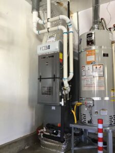 A residential furnace and water heater system installed by Gresham Heating and Air Conditioning in Wood Village, OR.