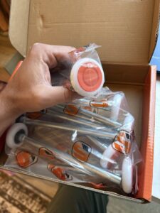 A well-maintained residential garage door on a brick house, showcasing a completed project by Cajun Doors & More in Lafayette, LA.