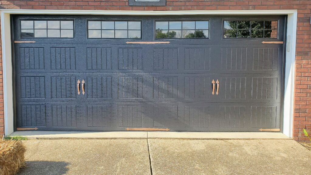 A newly installed residential garage door with decorative hardware and windows by Honest Overhead Garage Doors in Elizabethtown, KY.