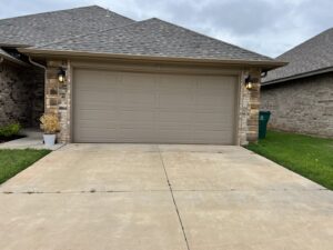 A newly installed residential garage door completed by Rhino Garage Doors LLC OKC in Edmond, OK.