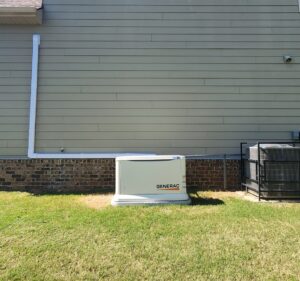 A Generac residential generator installed next to a home, with electrical conduit visible, by Generator Maintenance of Georgia in Atlanta, GA.