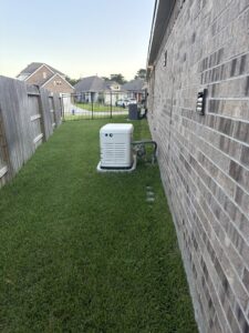 A residential Generac standby generator installed in a backyard by Never Without Power Generators LLC in Huffman, TX.