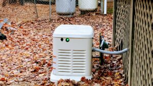 A residential backup generator installed in a backyard by Oak Electric LLC in Waterford, MI.
