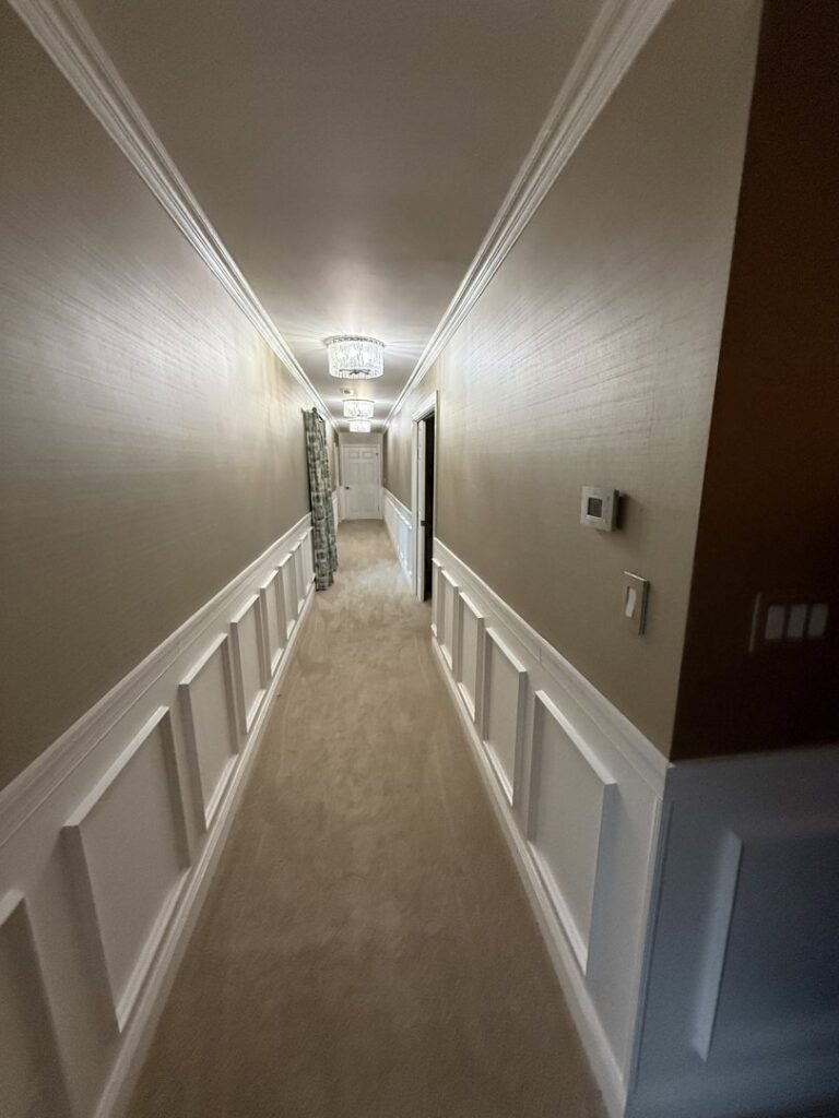 A newly installed carpet in a residential hallway by Beverly Hills Carpet & Tile in Huntington, WV.