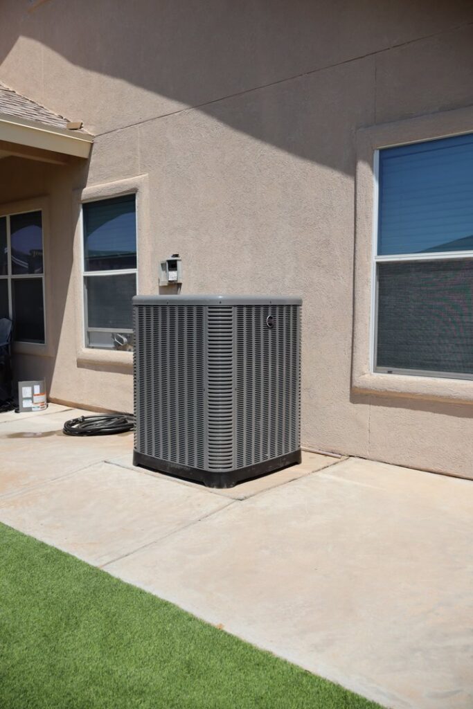 A residential outdoor HVAC condenser unit serviced by Ignitify Commercial Grade HVAC in El Paso, TX.