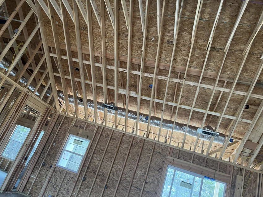 Residential HVAC duct installation in progress within a new home's framing by HBC in Cranston, RI.