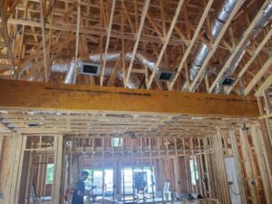 Flexible insulated HVAC ductwork installed in a residential attic by Huggins Mechanical in Jacksonville, FL