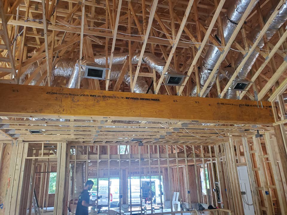 Flexible insulated HVAC ductwork installed in a residential attic by Huggins Mechanical in Jacksonville, FL