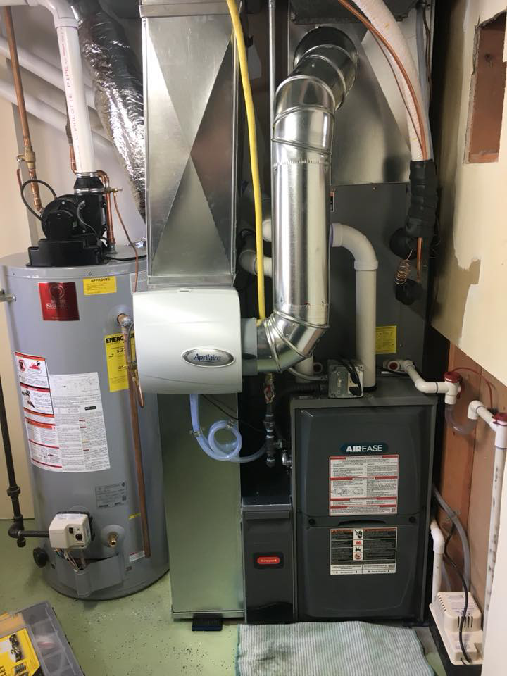 A residential HVAC furnace and humidifier system installed by Cool Fish Refrigeration, Heating, and Air in Minot, ND.