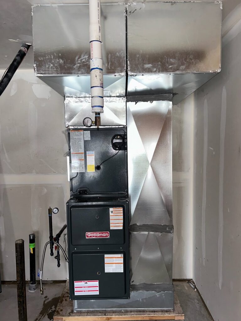 A residential HVAC furnace and air handler unit with ductwork installed in a new construction home by Integrity Heating And Air LLC in Nampa, ID