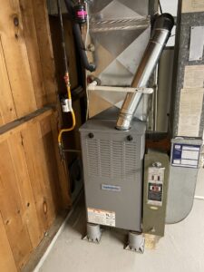 A residential HVAC furnace system with ductwork and gas lines installed by Berkshire Heating and Cooling in Pittsburgh, PA