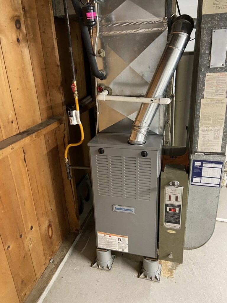 A residential HVAC furnace system with ductwork and gas lines installed by Berkshire Heating and Cooling in Pittsburgh, PA
