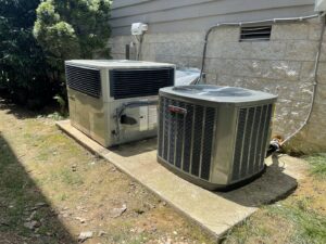 Two outdoor residential HVAC units, including a condenser and a package unit, installed by Breeze Heating & Cooling Nashville in Nolensville, TN.