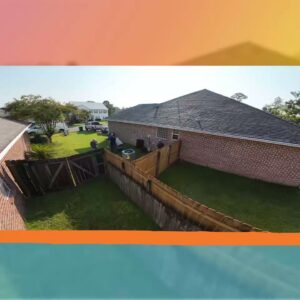 An aerial view of a residential backyard showing an outdoor HVAC unit next to the house by Anderson Mechanical Inc. in Pascagoula, MS