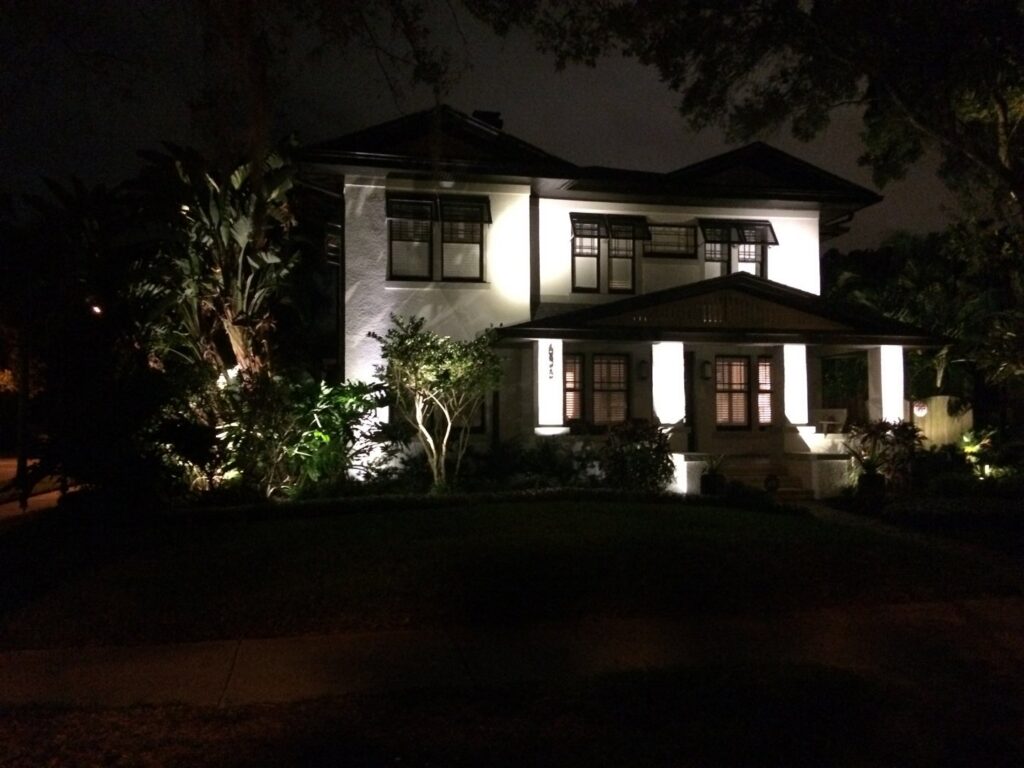 Residential landscape lighting illuminating a home at night by Everyday Electric in Tampa, FL.