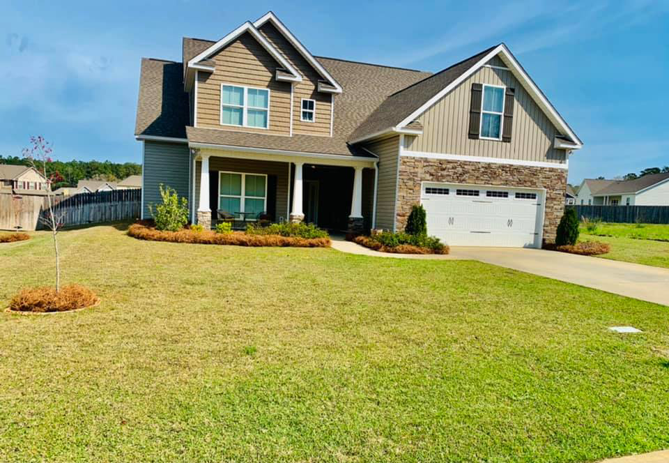 A residential property showcasing expert lawn maintenance and care from NewLeaf Lawn Care LLC in Dothan, AL.