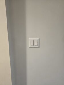 Standard residential light switch installation on a wall by Be Bright Electric in Erie, PA.
