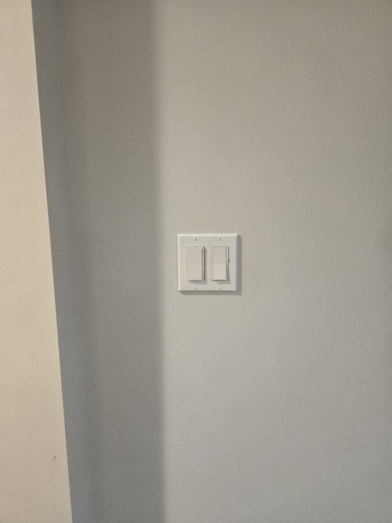 Standard residential light switch installation on a wall by Be Bright Electric in Erie, PA.