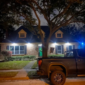 A residential lighting solution illuminating the front of a house, provided by Light of the World Electric in Lake City, FL.