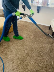 A professional cleaning residential living room carpet by DEEP CLEAN Carpet Cleaners in Beaverton, OR