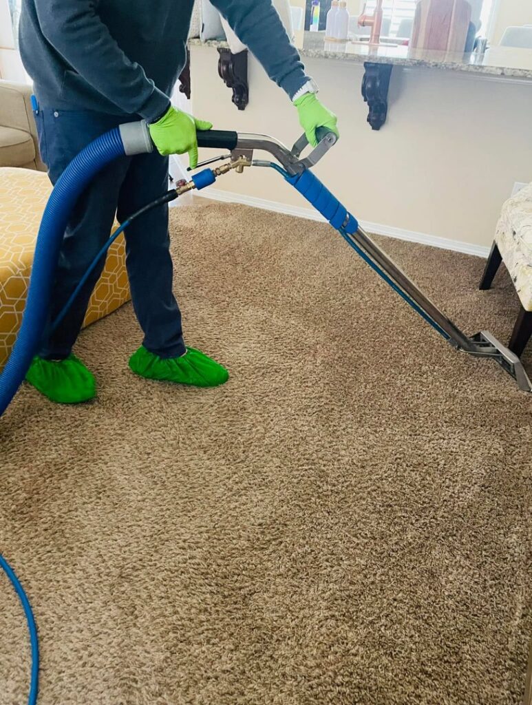 A professional cleaning residential living room carpet by DEEP CLEAN Carpet Cleaners in Beaverton, OR