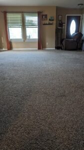 A spacious residential living room with new carpet installation by Carpets Mostly in Indianapolis, IN