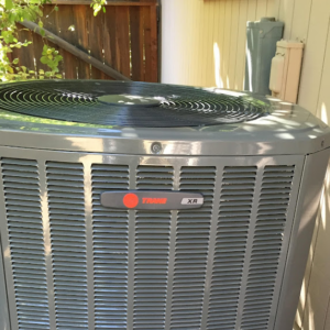 A residential Trane XR outdoor air conditioning unit next to a home, serviced by A and R Air Conditioning & Heating furnace in San Jose, CA.