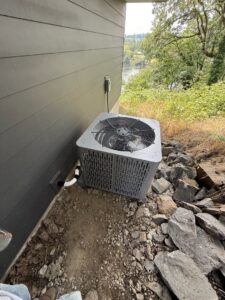 A residential outdoor air conditioning unit installed by Excellence Heating & Cooling, LLC. in Beaverton, OR.