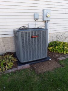 An outdoor residential air conditioning unit installed by Griffin HVAC in Peoria, IL