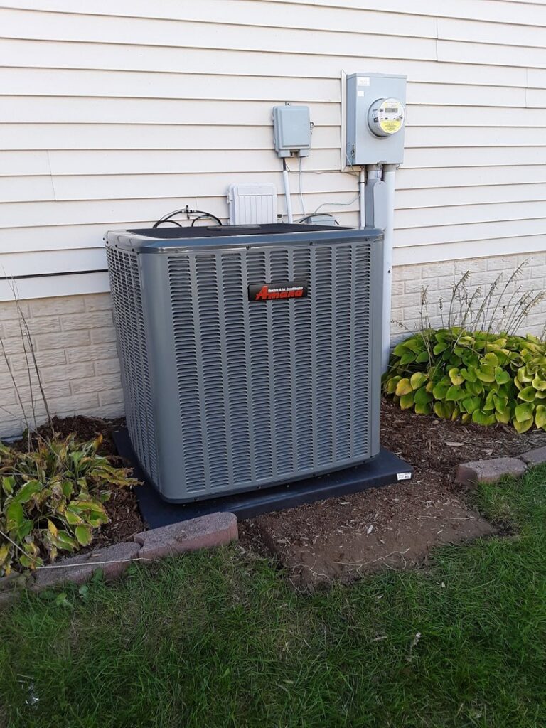 An outdoor residential air conditioning unit installed by Griffin HVAC in Peoria, IL