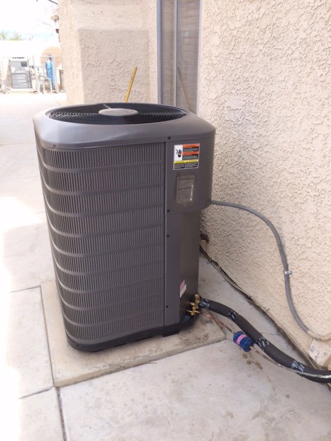 A residential outdoor air conditioning unit installation by AC Plus Heating & Air Conditioning Service in Las Vegas, NV.