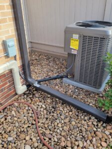 A residential outdoor AC unit installed by Kraemer Mechanical in Broomfield, CO.