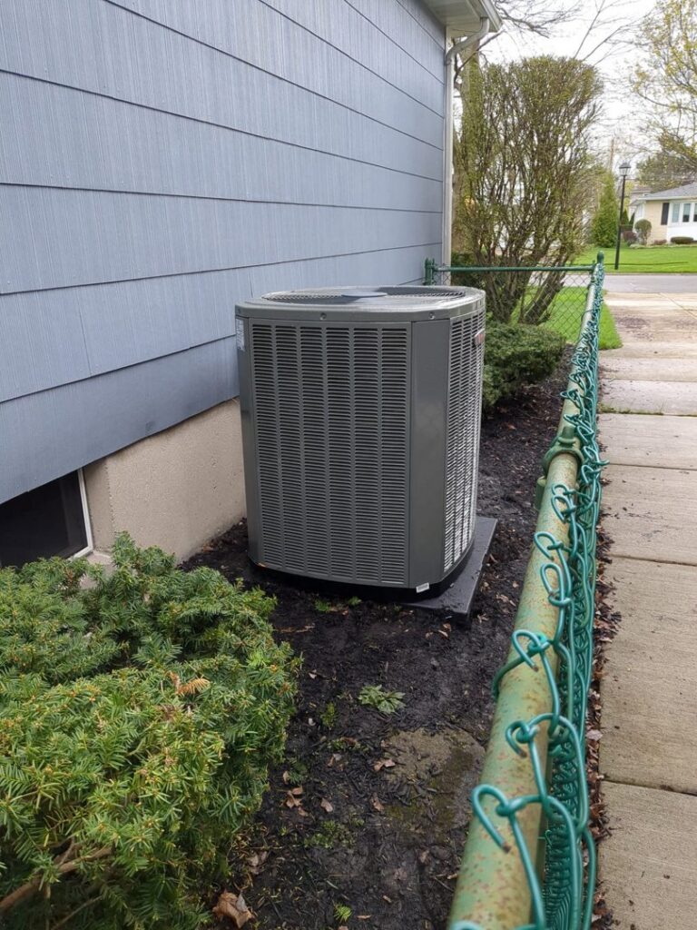 A newly installed residential outdoor air conditioning unit by Sullivan Heating & Cooling in Depew, NY