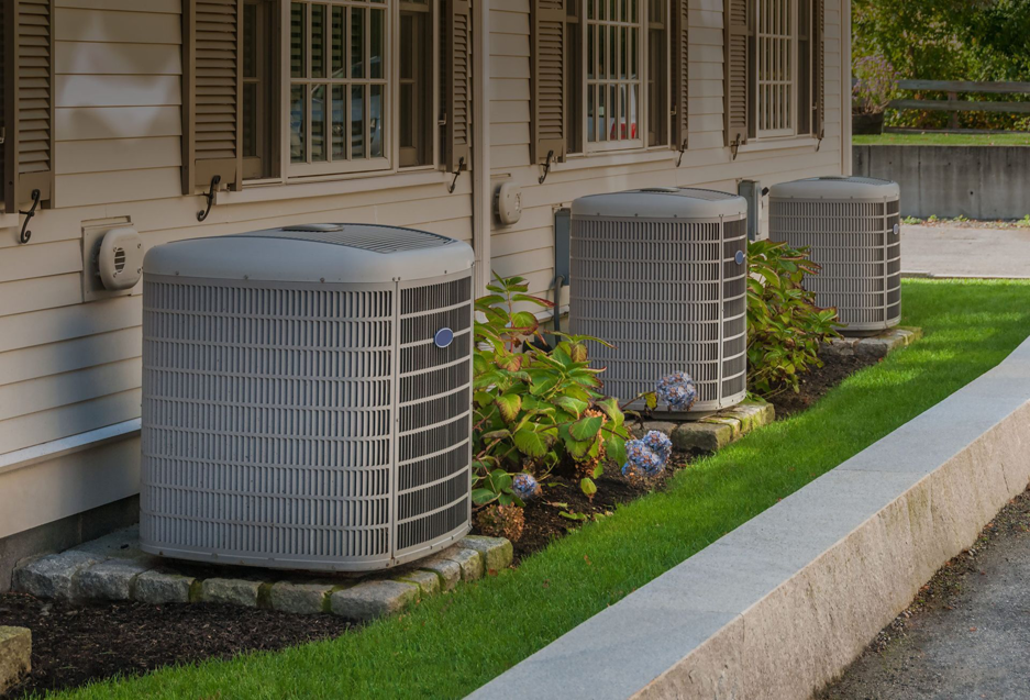 Three residential outdoor air conditioning units installed by Accurate HVAC in Vacaville, CA.
