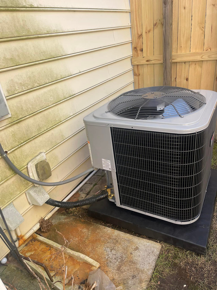 A residential outdoor HVAC condenser unit installed next to a home by Wicked Cool HVAC in Charleston, SC.