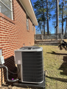 A residential outdoor HVAC condenser unit installed by Affordable heating and air conditioning in Meridian, MS.