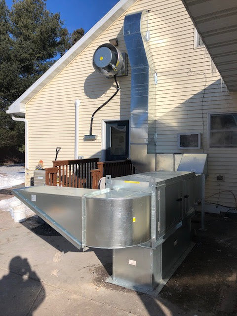 Residential outdoor HVAC unit and ductwork installation by Sheet Metal Solutions, LLC in Duluth, MN.