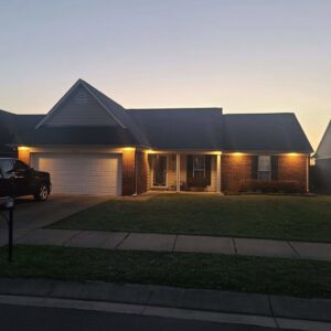 Residential outdoor lighting illuminating a home's exterior by Superior Electric and Lighting LLC in Southaven, MS