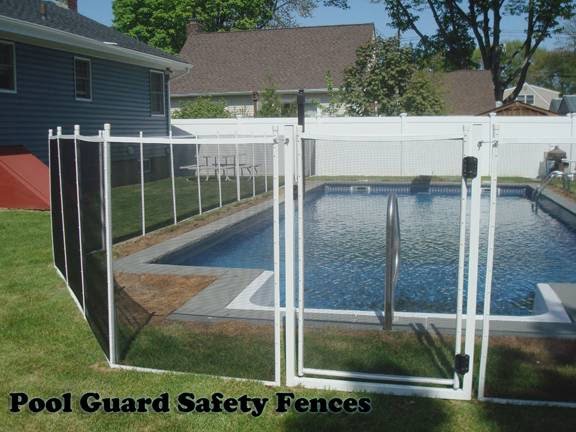 A residential pool secured with a black mesh safety fence, showcasing work by Pool Guard in North Charleston, SC.