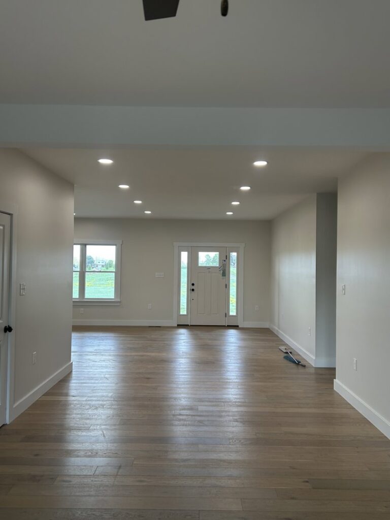 A bright residential room featuring multiple recessed lights in the ceiling, demonstrating electrical work by Superior Electrical Solutions llc in Clear Spring, MD.