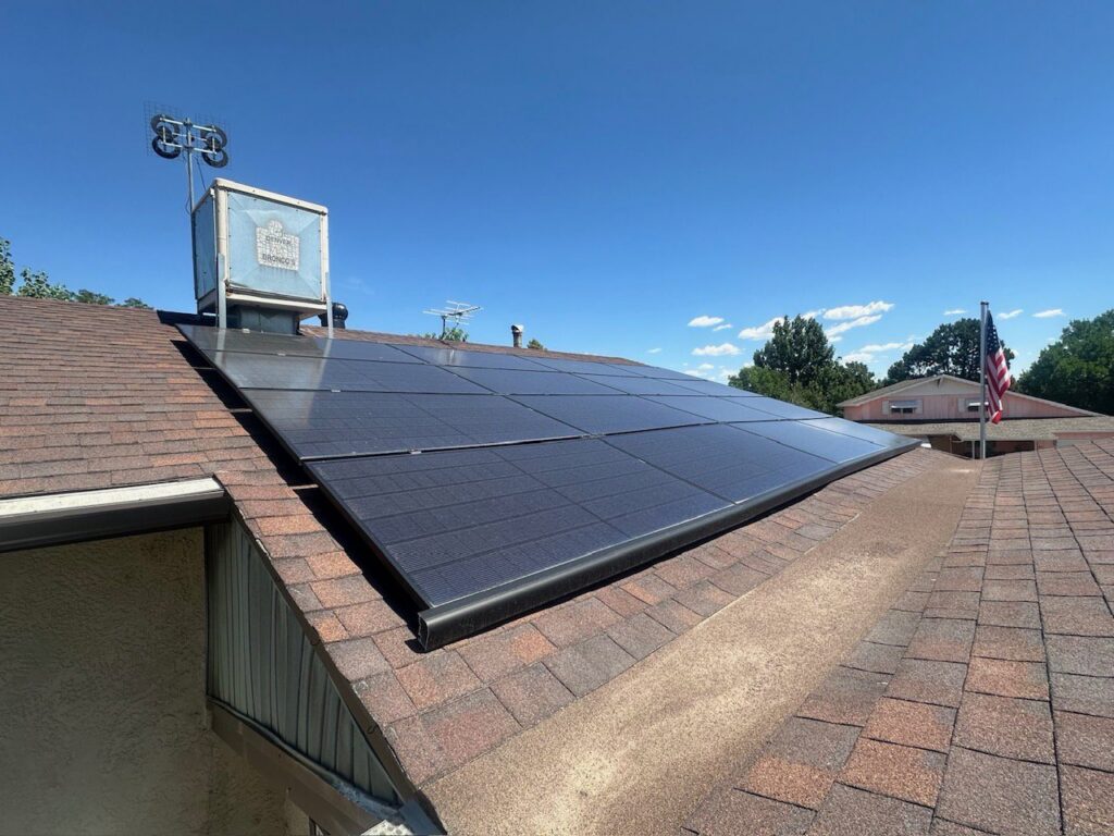 Newly installed solar panels on a residential rooftop, showcasing work by Pueblo Electrics, Inc. in Pueblo, CO.